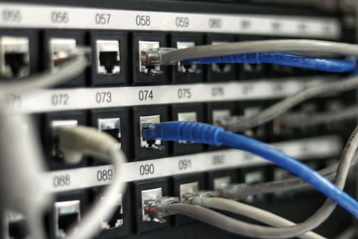 Structured cabling installation with organized patch panels and labeled cable runs in a New Hampshire office building